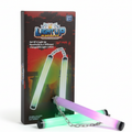 Light-up ninja nunchucks glowing green and purple with a metal chain, lying in front of the retail box